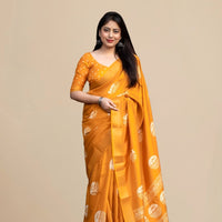 Studio front view of yellow saree showing print and elegant shape