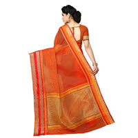 lowing pallu of the saree showing gold border against soft orange backdrop