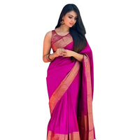 Studio front pose of soft pink silk saree draped neatly – white background