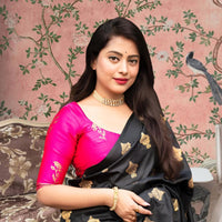 Front view of black silk saree with pink blouse in royal setting