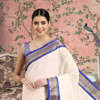 Front view of royal blue checkered saree in regal setting