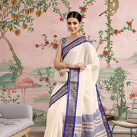 Front view of royal blue checkered saree in regal setting