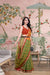  Front view of Mehendi green checkered saree in palace ambiance