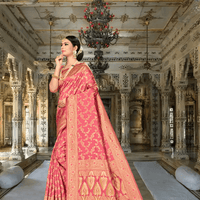 Model in rich red silk blend saree with golden motifs inside a palace room