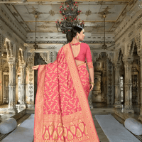 Gold-accented red saree pallu flowing in royal palace setting
