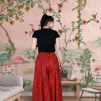 Back view showing rich red hue and flowy silhouette