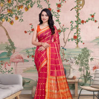  Front view of red checkered saree glowing in palace light