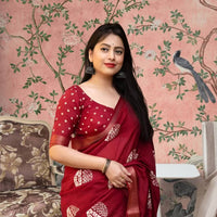 Front view of ❤️ Lohini red cotton crape printed saree styled in ethnic setting
