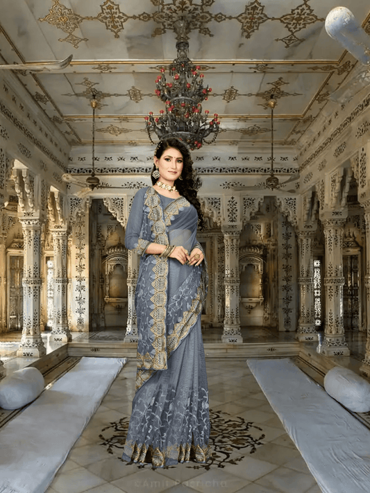 Model mid-step, saree flowing like frozen smoke, silver stitching catching light