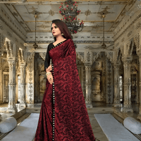 Close-up of premium Lycra fabric - wrinkle-resistant maroon office saree material