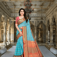 Sky blue Kota Doria saree with dot patterns worn in full front standing pose.