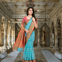 Side view of MeghMalika saree showcasing elegant pallu and dot detailing against lifestyle background.