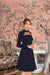 Closeup of high neckline and smooth knit detail