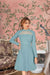 Front view of pista green full-sleeve monochrome dress