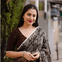Coffee brown ombre saree in rustic café setting – liquid elegance