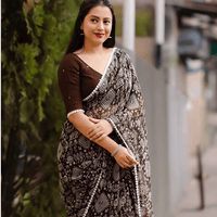 Model flipping pallu to show caramel gradient magic
