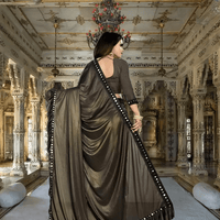 Professional woman wearing mocha saree in corporate setting