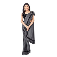 Young woman twirling in grey Lycra saree for Instagram look