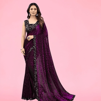 Woman twirling in wine floral saree for evening party