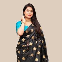 Studio front view of black silk printed saree and blouse contrast