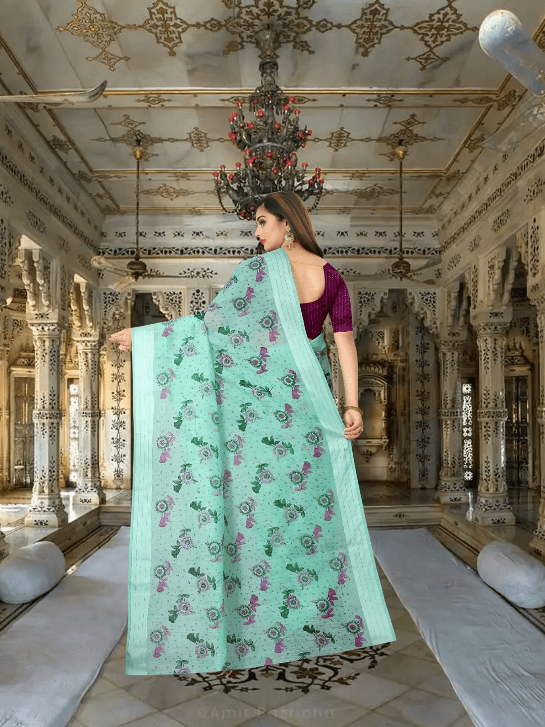 Full pallu view of floral printed cotton saree flowing naturally in palace setting
