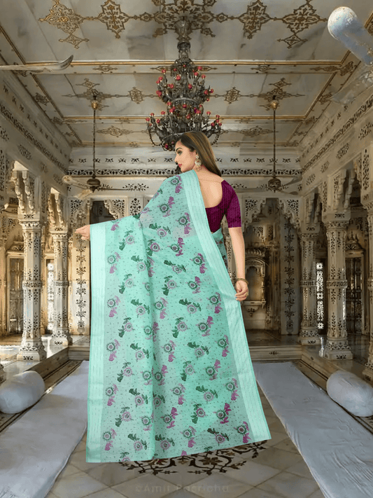 Full pallu view of floral printed cotton saree flowing naturally in palace setting