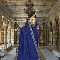 Sweeping pallu of digitally printed navy saree in royal setting