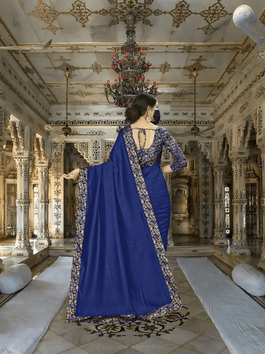 Sweeping pallu of digitally printed navy saree in royal setting