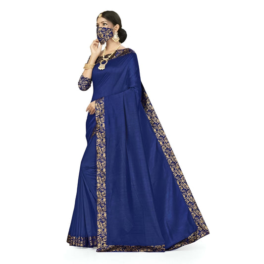 Pink blouse paired with navy blue printed saree against white background