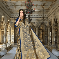 Model in blue Banarasi silk saree with golden motifs in royal palace setting