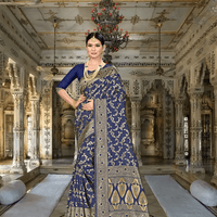 Model draped in navy blue silk blend saree with golden motifs in palace room