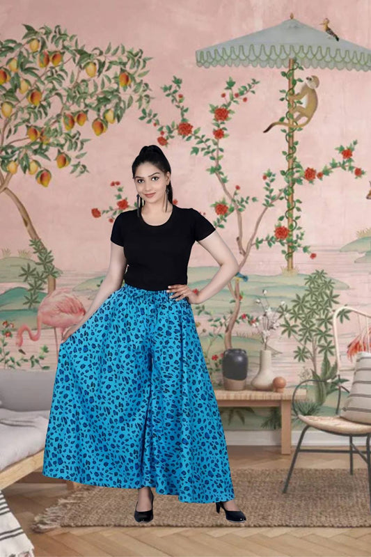 Front view of light blue cotton palazzo pants in palace backdrop