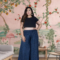 Front view of blue cotton printed palazzo pants in palace interior