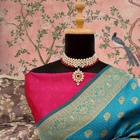 Closeup of silk texture and gold-toned Banarasi weave – ambient light