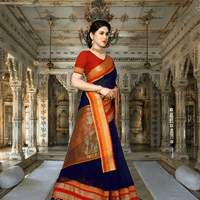 Model seated gracefully in traditional setting, saree folds fanned like poetry on stone floor