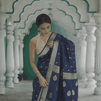 Model draped in full view, navy cotton flowing like calm waters