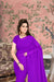  Front view of purple plain georgette saree in elegant setting