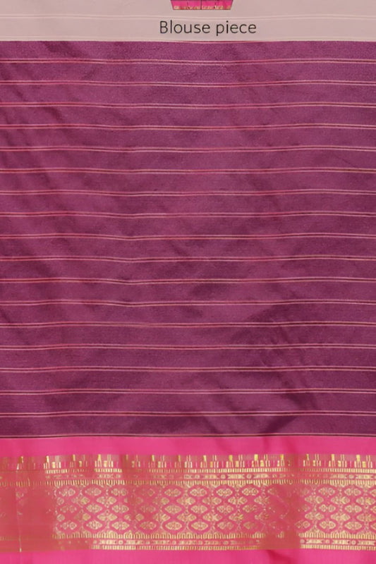 Studio close-up of navy checkered pallu and gold edge glint