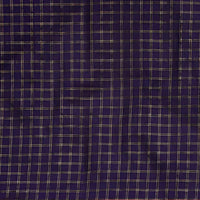 Studio close-up of navy checkered pallu and gold edge glint