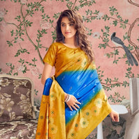 Front view of blue-yellow cotton saree glowing in regal palace setting