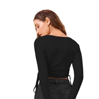 Studio back view of CELESTINA black polyester top