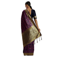Golden zari pallu of navy pink saree detailed on white background