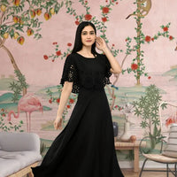  Front view of black sleeveless crepe gown in regal room