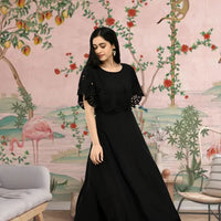 Side angle of long black sleeveless heritage gown
