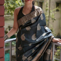 Model stands poised with silk gracefully flowing