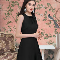 Side angle of Celestina’s sleeveless black polyester dress with round neck

