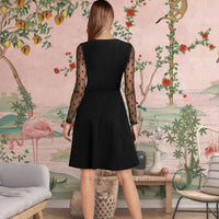Back view of black dress showing soft fit and sheer shoulder detail