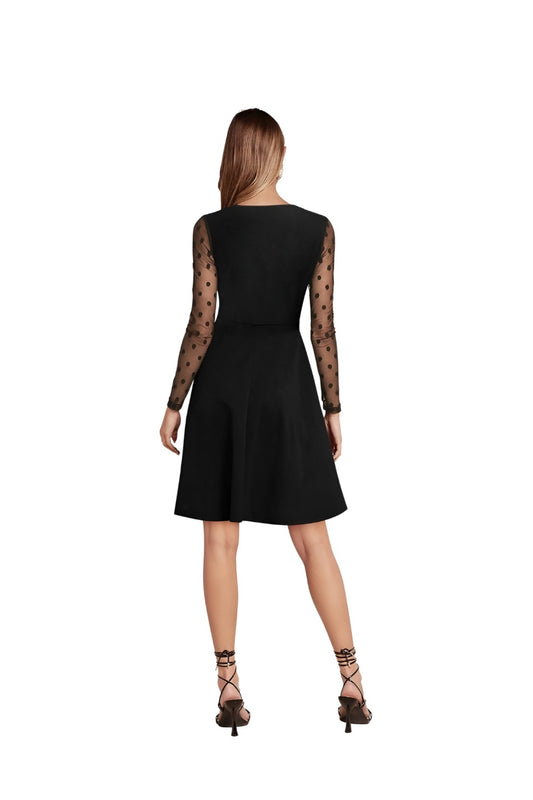 Studio back view – simple black silhouette, clean lines
