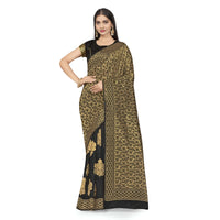 Close-up of golden abstract motifs on deep black Banarasi silk