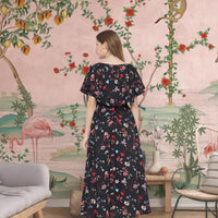 Back view of black floral CELESTINA crepe gown